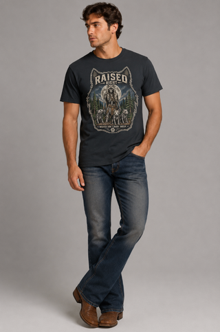 Man wearing a graphic t-shirt and jeans on a gray background